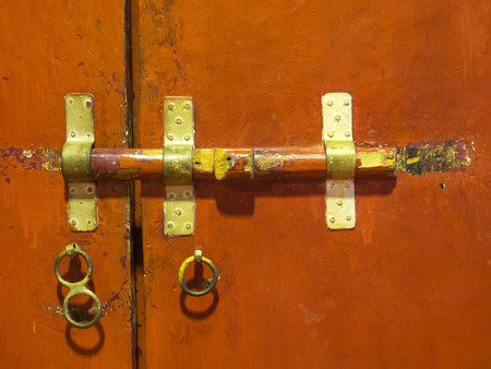 Old style door locking inside Thai templeの写真素材