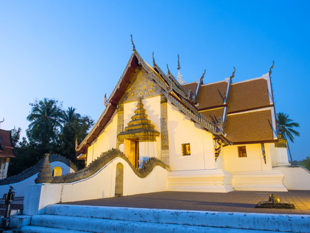 Main church of Wat Phu Mintr is very outstanding Northern style Thai art under twilight period skyの写真素材