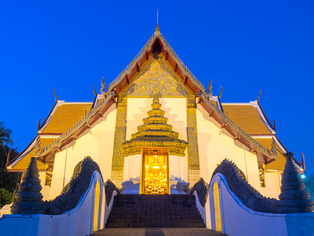 Main church of Wat Phu Mintr is very outstanding Northern style Thai art under twilight period skyの写真素材