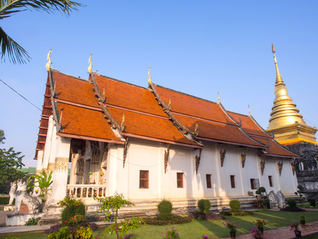 Church of Northern stlye Thai art in Nan, Thailand under blue skyの写真素材