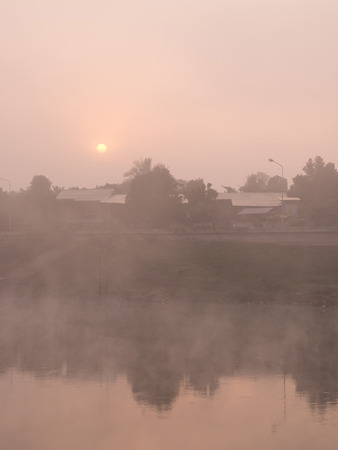 Riverside view in morning blur fogの写真素材