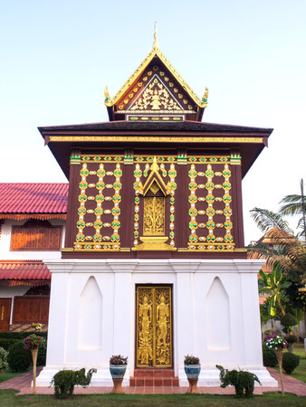 Church of Buddist book in unique Northern style Thai art under blue skyの写真素材
