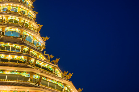 Chinese style nine level pagoda in Thai temple under twilight sky twilight skyの写真素材