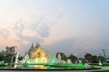 White temple with evening sky is unique beautiful Thai art in Chiangraiの写真素材