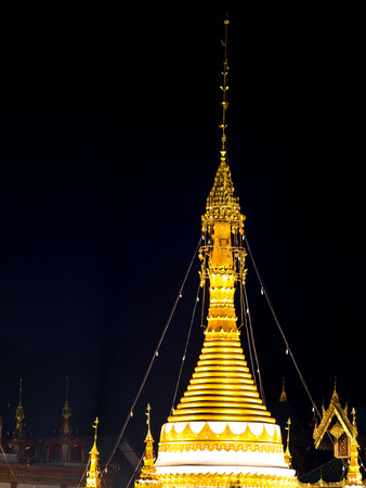 Tip delicate art of Wat Jong Klang, unique fusion Burmese and Thai art in Thailand, on dark night black backgroundの写真素材