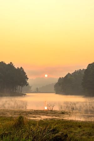 Pang Oung is pretty and serene lake in a valley glittering with sunlight in morning sunrise surrounded by mountainsの写真素材