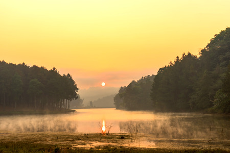 Pang Oung is pretty and serene lake in a valley glittering with sunlight in morning sunrise surrounded by mountainsの写真素材
