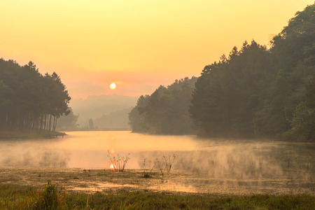 Pang Oung is pretty and serene lake in a valley glittering with sunlight in morning sunrise surrounded by mountainsの写真素材