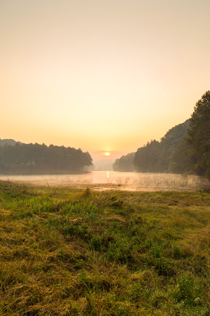 Pang Oung is pretty and serene lake in a valley glittering with sunlight in morning sunrise surrounded by mountainsの写真素材