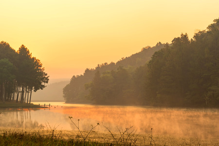Pang Oung is pretty and serene lake in a valley glittering with sunlight in morning sunrise surrounded by mountainsの写真素材