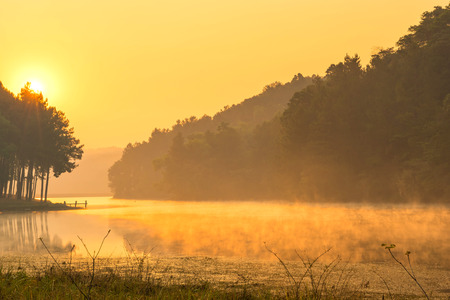 Pang Oung is pretty and serene lake in a valley glittering with sunlight in morning sunrise surrounded by mountainsの写真素材