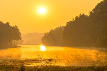 Pang Oung is pretty and serene lake in a valley glittering with sunlight in morning sunrise surrounded by mountainsの写真素材