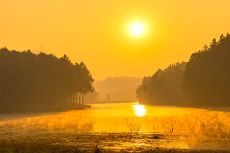 Pang Oung is pretty and serene lake in a valley glittering with sunlight in morning sunrise surrounded by mountainsの写真素材