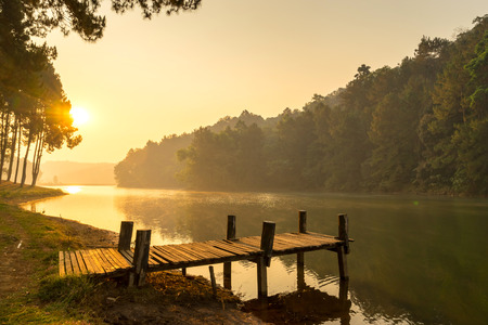 Pang Oung is pretty and serene lake in a valley glittering with sunlight in morning sunrise surrounded by mountainsの写真素材