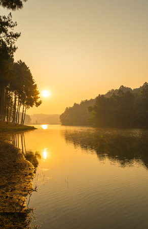 Pang Oung is pretty and serene lake in a valley glittering with sunlight in morning sunrise surrounded by mountainsの写真素材