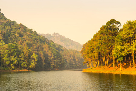 Pang Oung is pretty and serene lake in a valley glittering with sunlight in morning sunrise surrounded by mountainsの写真素材