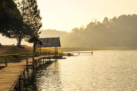 Pang Oung is pretty and serene lake in a valley glittering with sunlight in morning sunrise surrounded by mountainsの写真素材
