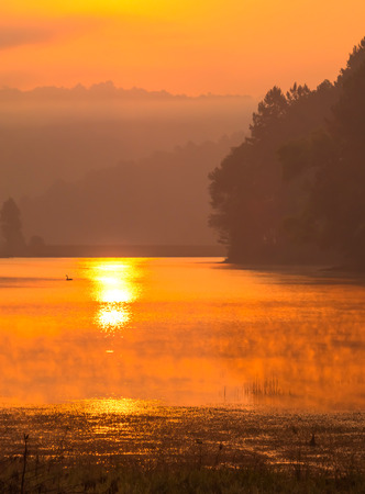 Pang Oung is pretty and serene lake in a valley glittering with sunlight in morning sunrise surrounded by mountainsの写真素材