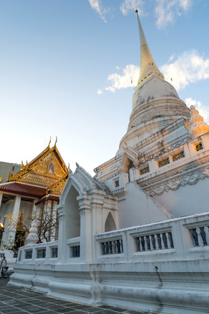 Main church and white pagoda of Wat Pathum in Siam Square area in Bangkok, Thailandの写真素材