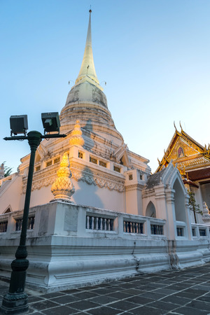 Main church and white pagoda of Wat Pathum in Siam Square area in Bangkok, Thailandの写真素材