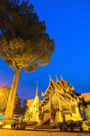 Little church of Wat Jedi Luang in twilight evening period in Chiangmai. Outstanding with unique Northern Thai art.の写真素材