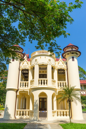 Left wing of Sanamchan palace with surrounding tree under blue skyのeditorial素材