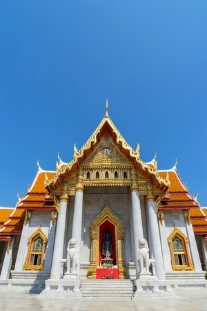 Marble temple is landmark of Bangkok, Thailand, under blue skyの写真素材
