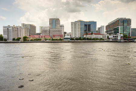 Buildings of Siriraj hospital the first hospital in Thailand along Chaophraya river under cloudy skyのeditorial素材