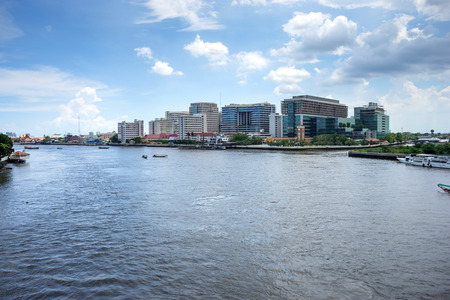 Buildings of Siriraj hospital the first hospital in Thailand along Chaophraya river under cloudy skyのeditorial素材