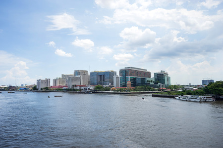 Buildings of Siriraj hospital the first hospital in Thailand along Chaophraya river under cloudy skyのeditorial素材