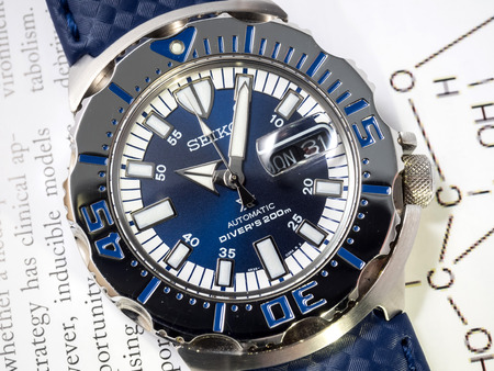 BANGKOK - SEPTEMBER 2: Seiko diver automatic watch, Royal blue monster limited model for only Thailand, place on chemistry journal paper selective focus on watch dial, was taken on September 2, 2015, in Bangkok, Thailand.のeditorial素材