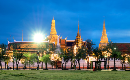 Outside beautiful landmark view of The Grand Emerald temple in Bangkok, Thailand with night light view and street light flareの写真素材