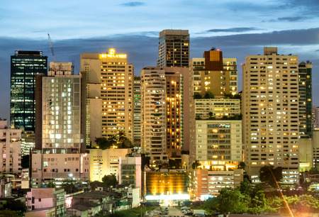 BANGKOK - AUGUST 8: Bangkok skyscraper buildings under twilight evening sky with night light view, was taken on August 8, 2015, in Bangkok, Thailandのeditorial素材