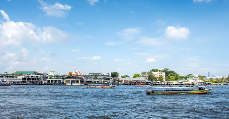BANGKOK - AUGUST 9: Scenic view along Chaophraya river with building and living in Bangkok, Thailand, was taken on August 9, 2015.のeditorial素材