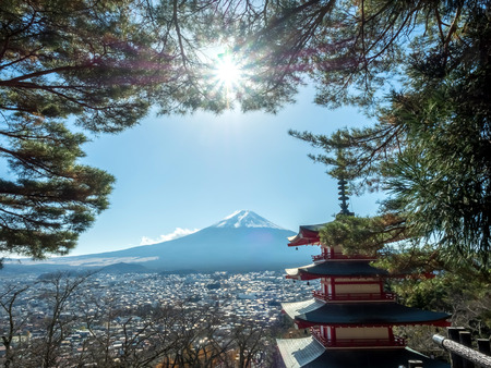 Chureito pagoda with Fuji mountain view under blue sky in Japan with sunlight flareのeditorial素材