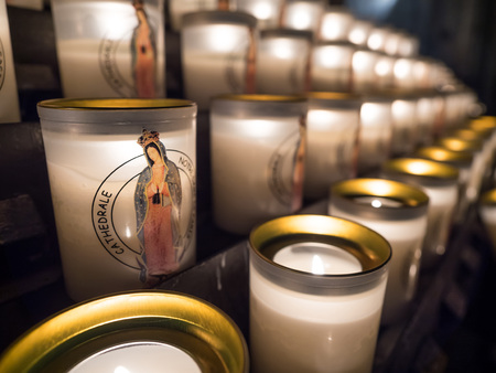 Group of beautiful candle and light of candles in Notre dame cathedral in Paris, Franceの写真素材