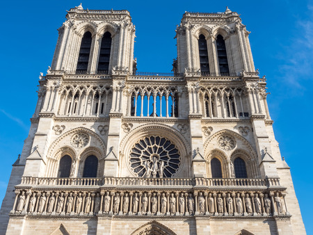 Notre dame cathedral is landmark of Paris, France, under blue skyの写真素材