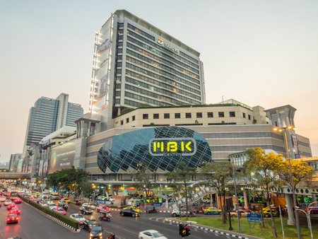 BANGKOK - FEBRUARY 8: MBK shopping with traffic crossroads in twilight evening time under clear sky in Bangkok, Thailand, was taken on February 8, 2016.のeditorial素材