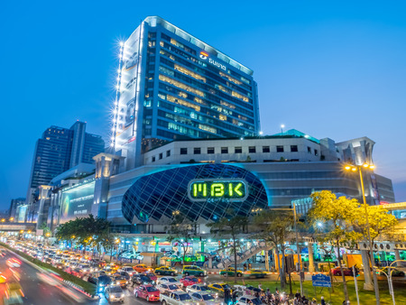 BANGKOK - FEBRUARY 8: MBK shopping with traffic crossroads in twilight evening time under clear sky in Bangkok, Thailand, was taken on February 8, 2016.のeditorial素材