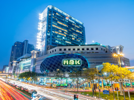 BANGKOK - FEBRUARY 8: MBK shopping with traffic crossroads in twilight evening time under clear sky in Bangkok, Thailand, was taken on February 8, 2016.のeditorial素材