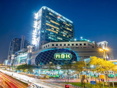 BANGKOK - FEBRUARY 8: MBK shopping with traffic crossroads in twilight evening time under clear sky in Bangkok, Thailand, was taken on February 8, 2016.のeditorial素材