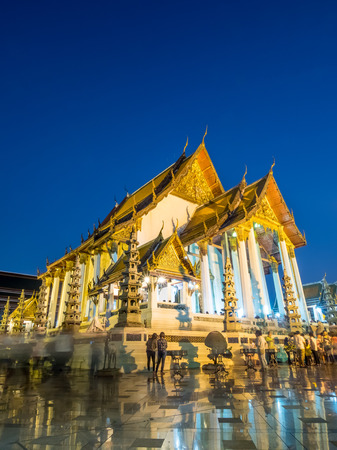 Candle lit triple times around church of temple of Wat Suthat in Bangkok, Thailand, on Buddhist All Saint's day Maka Bucha dayの写真素材