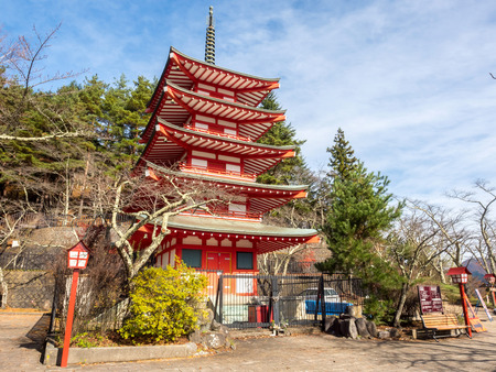 Five storeys red pagoda, Chureito, is landmark near Fuji mountain in Kawaguchiko in Japan, under cloudy blue skyのeditorial素材
