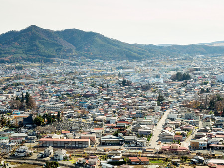 Cityscape of Shimoyoshida town, near Kawaguchiko lake, in Japan, view from hill under cloudy skyのeditorial素材