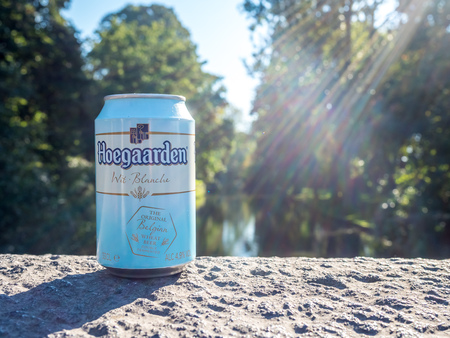 BRUGGE - SEPTEMBER 30: Hoegaarden beer is famous beverage, this can under natural sunlight in Brugge, Belgium, was taken on September 30, 2015.のeditorial素材