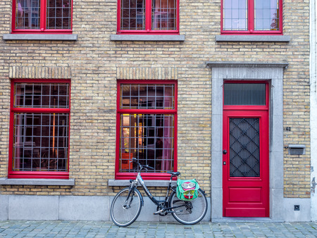 Brugge city scenes in Belgium, residential buildings, church, attractive and beautiful scenes, under blue skyの写真素材