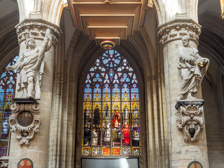 The interior decoration and architecture of Saint Michael and Saint Gudule Cathedral in Brussels, Belgium, under clear blue skyのeditorial素材