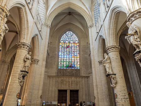 The interior decoration and architecture of Saint Michael and Saint Gudule Cathedral in Brussels, Belgium, under clear blue skyの写真素材