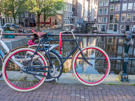 AMSTERDAM - OCTOBER 2: Bicycle park along bridge over canal in Red-light district in Amsterdam, Netherlands, was taken on October 2, 2105.のeditorial素材