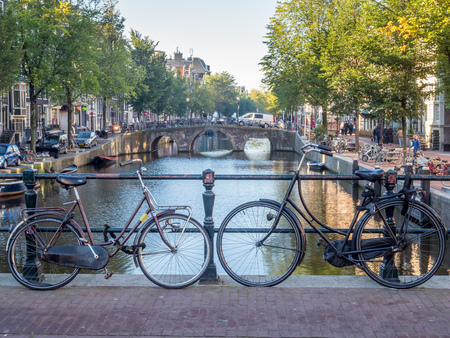 AMSTERDAM - OCTOBER 2: Bicycle park along bridge over canal in Red-light district in Amsterdam, Netherlands, was taken on October 2, 2105.のeditorial素材